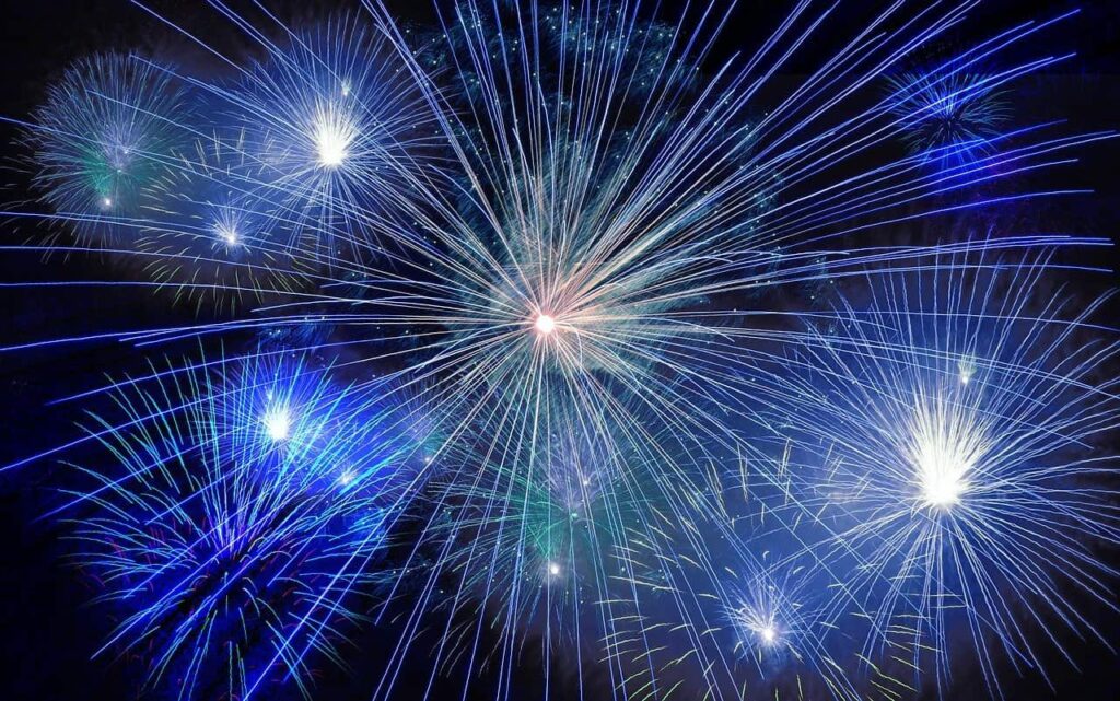 blue starburst fireworks in the night sky